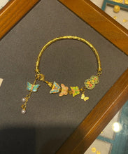 Load image into Gallery viewer, Fine Gold Ancient Gold Pearl Enamel Butterfly Tassel Bangle