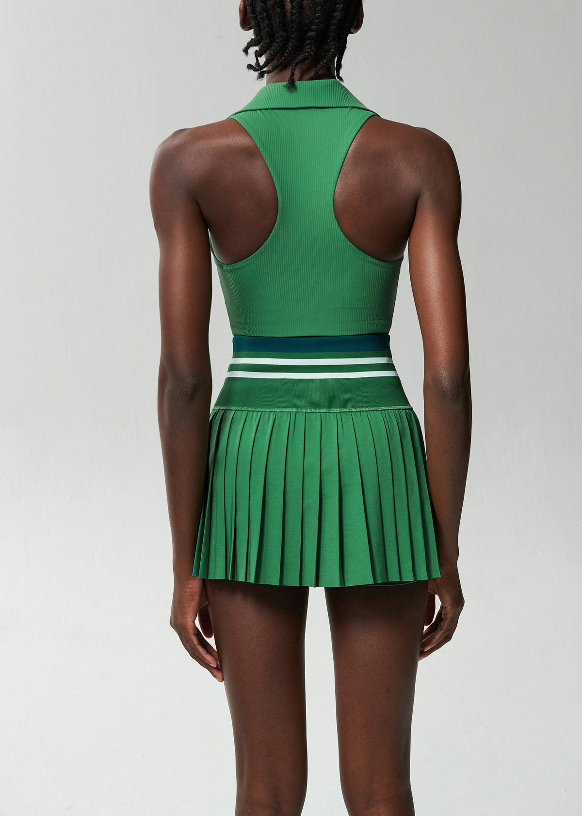 Modern Green V Neck Sleeveless High Waist Built-In Shorts Pleated Skirt Athletic Two Piece Set