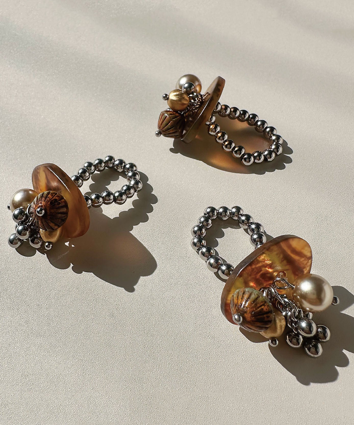 Stylish Brown Tassel Bead Glazed Titanium Steel Rings