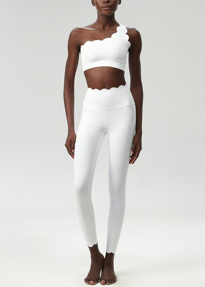 Stylish White Scalloped Asymmetrical Sleeveless Sports Bra And Leggings Set Suit