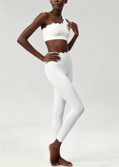 Stylish White Scalloped Asymmetrical Sleeveless Sports Bra And Leggings Set Suit
