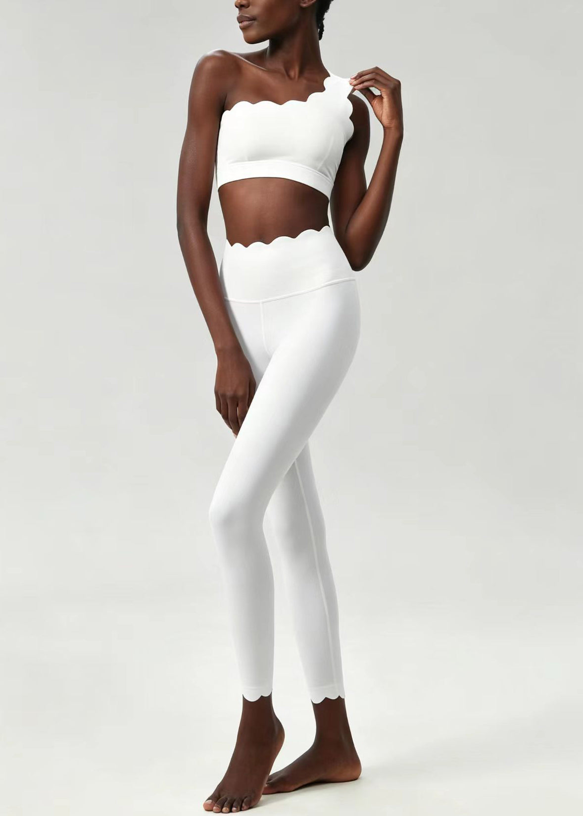 Stylish White Scalloped Asymmetrical Sleeveless Sports Bra And Leggings Set Suit